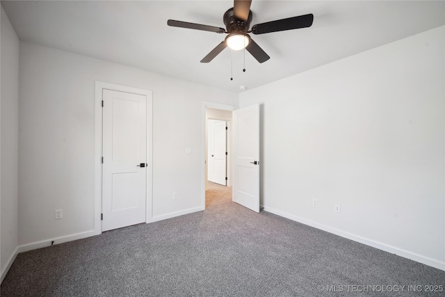 unfurnished room with carpet flooring and ceiling fan