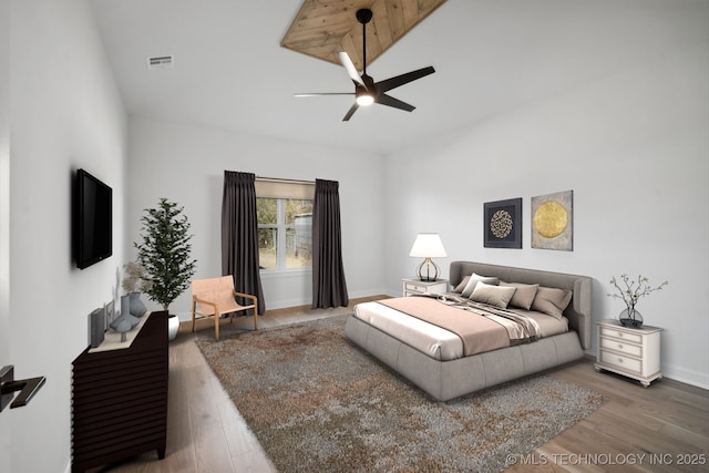 bedroom featuring ceiling fan and wood-type flooring