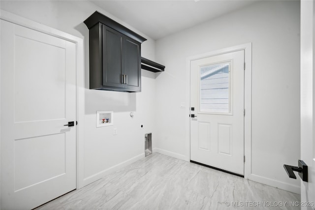 clothes washing area featuring cabinets, gas dryer hookup, washer hookup, and hookup for an electric dryer