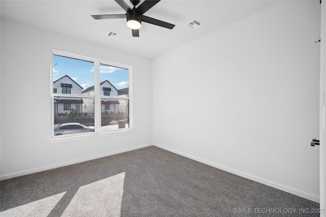 unfurnished room featuring ceiling fan and carpet floors