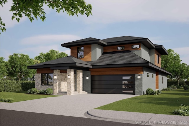 view of front of house featuring a front yard and a garage