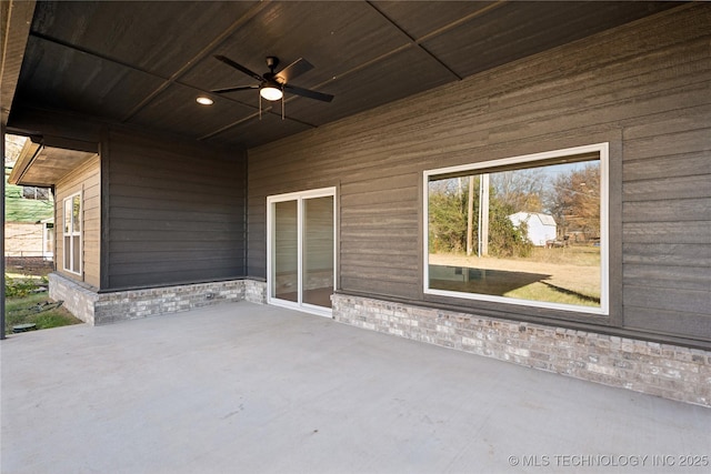 view of patio featuring ceiling fan