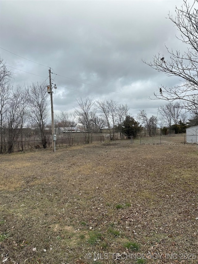 view of yard with a rural view