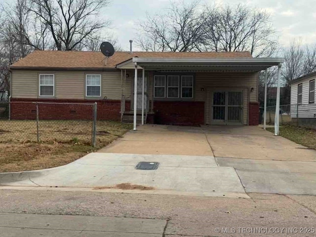 ranch-style house featuring a carport