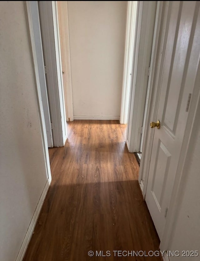 hall with dark hardwood / wood-style floors