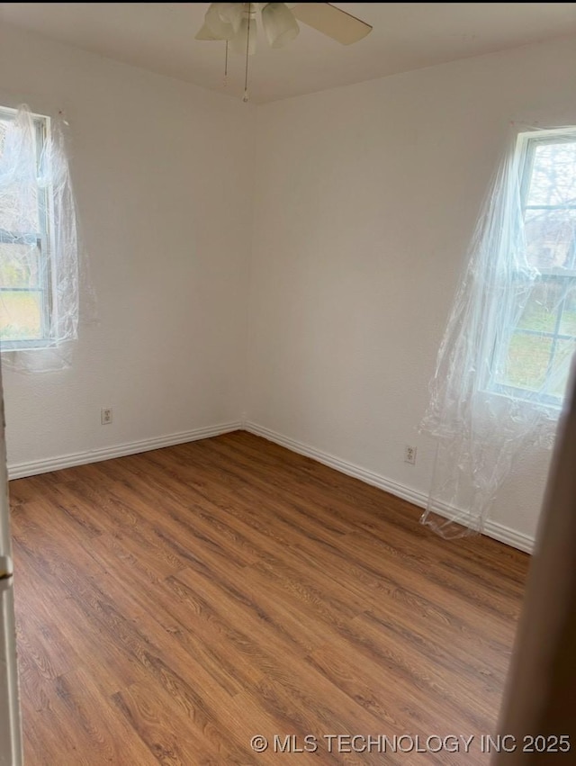 unfurnished room featuring hardwood / wood-style flooring