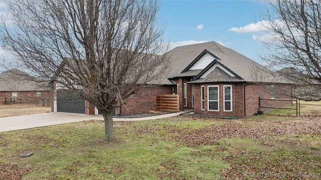 view of front of house featuring a garage and a front lawn