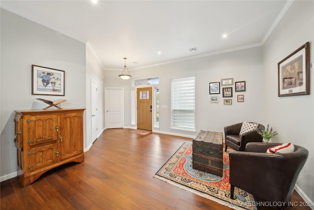 interior space with wood-type flooring and crown molding