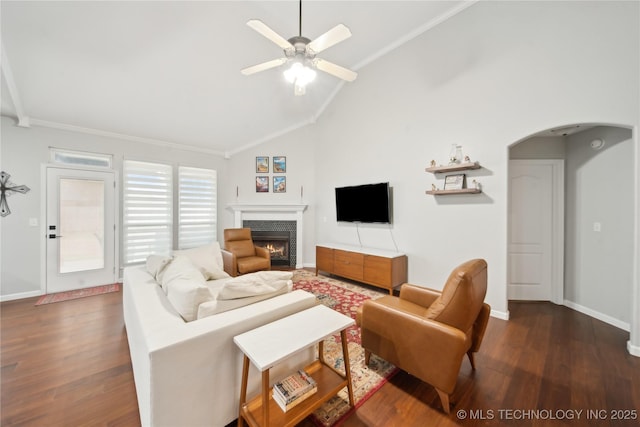 living room featuring ceiling fan, crown molding, dark hardwood / wood-style floors, and lofted ceiling