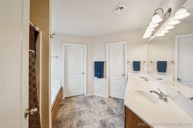 bathroom with vanity and a tub to relax in