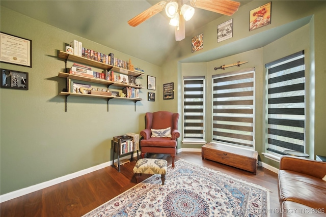 sitting room featuring ceiling fan, hardwood / wood-style floors, and vaulted ceiling