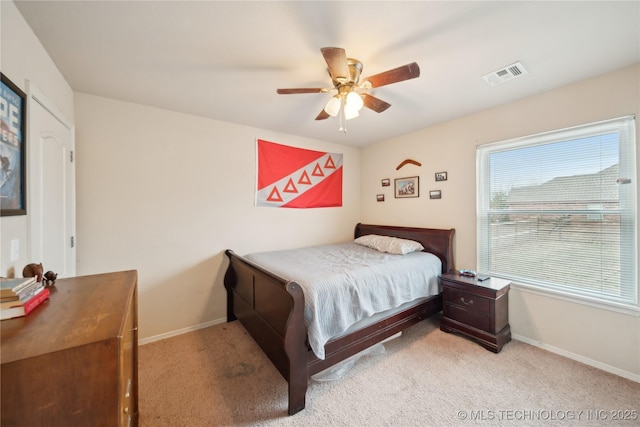 carpeted bedroom with ceiling fan