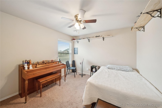 bedroom with ceiling fan and light carpet