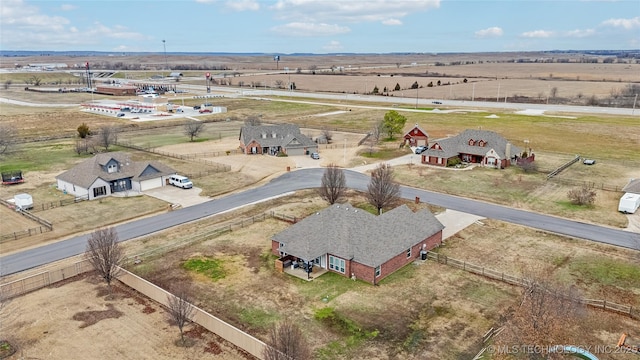 birds eye view of property with a rural view