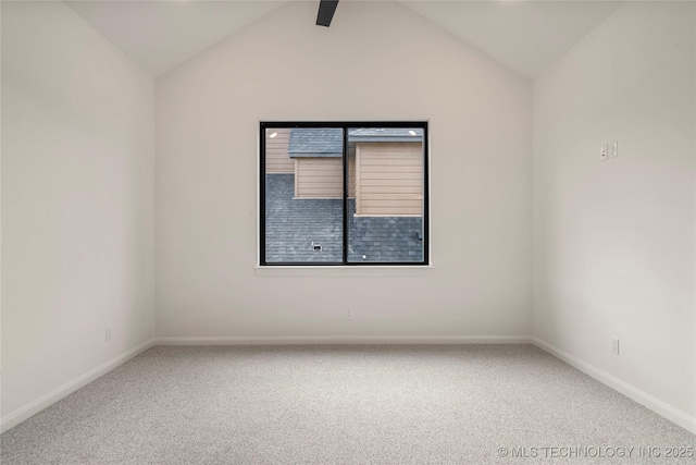 unfurnished room with carpet and vaulted ceiling with beams