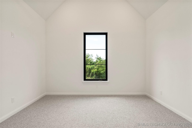 unfurnished room with carpet and lofted ceiling