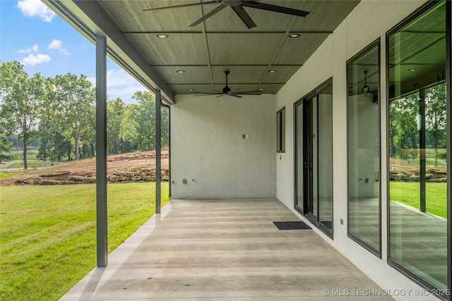 view of patio featuring ceiling fan