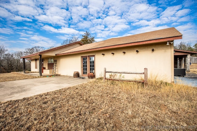 back of house with a patio