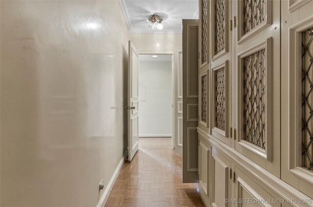 hall with crown molding and light parquet floors