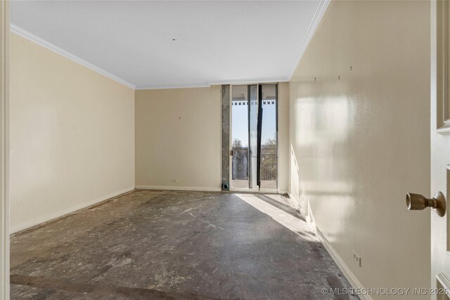 spare room featuring floor to ceiling windows and ornamental molding