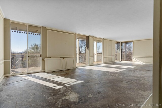 spare room with concrete flooring