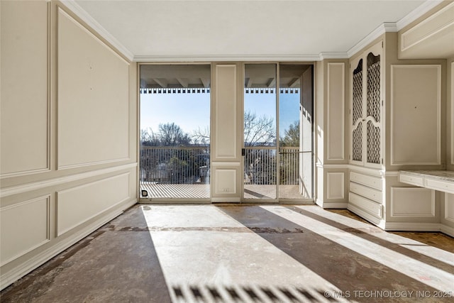 doorway to outside with floor to ceiling windows and ornamental molding