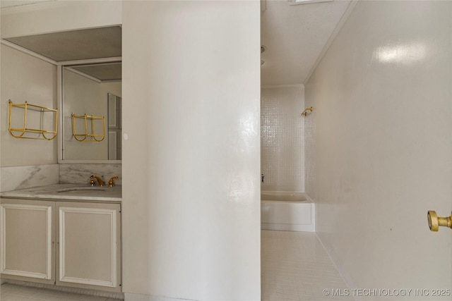 bathroom featuring tile patterned flooring, vanity, and shower / washtub combination