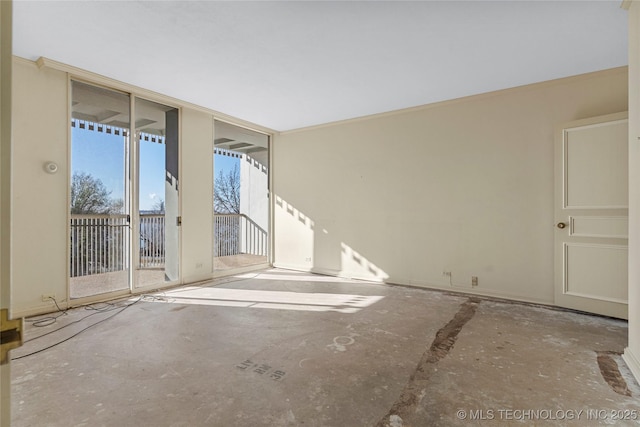 spare room featuring floor to ceiling windows