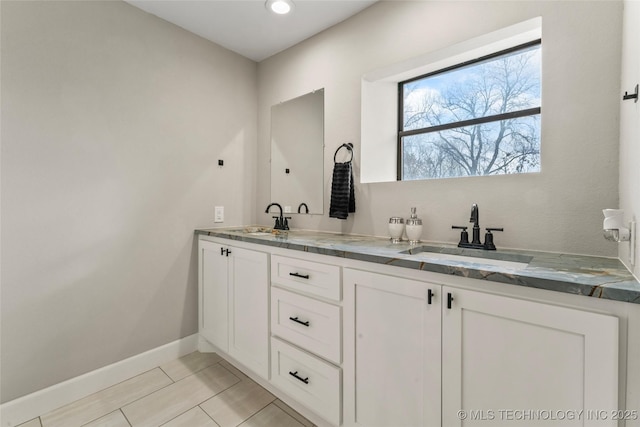 bathroom with tile patterned floors and vanity