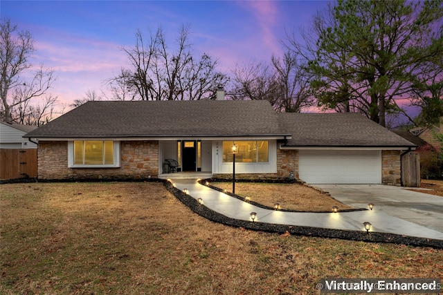 ranch-style home featuring a garage