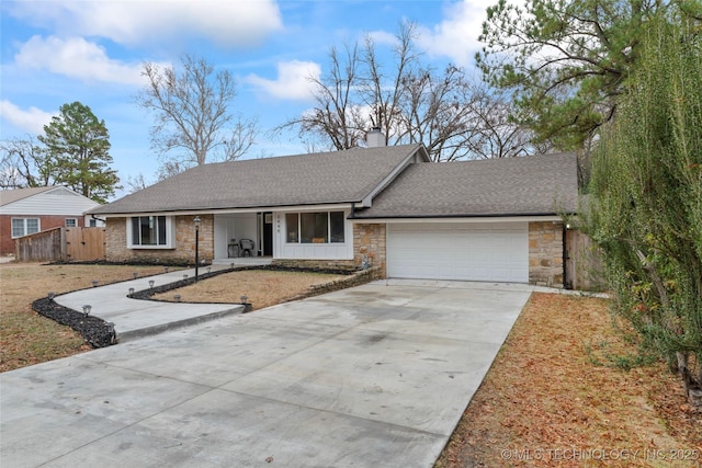 ranch-style home with a front lawn and a garage