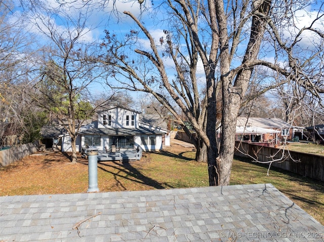 view of front of property with a patio and a front lawn