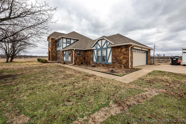 view of front of house with a garage and a front lawn