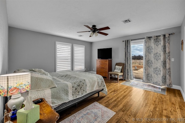 bedroom with hardwood / wood-style flooring and ceiling fan