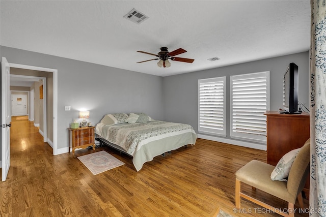 bedroom featuring ceiling fan and wood-type flooring