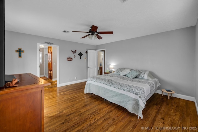 bedroom with dark hardwood / wood-style floors and ceiling fan