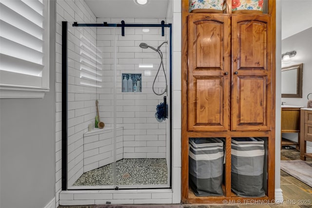 bathroom featuring vanity and an enclosed shower