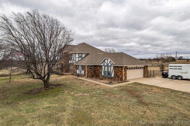 view of front of property featuring a garage and a front yard