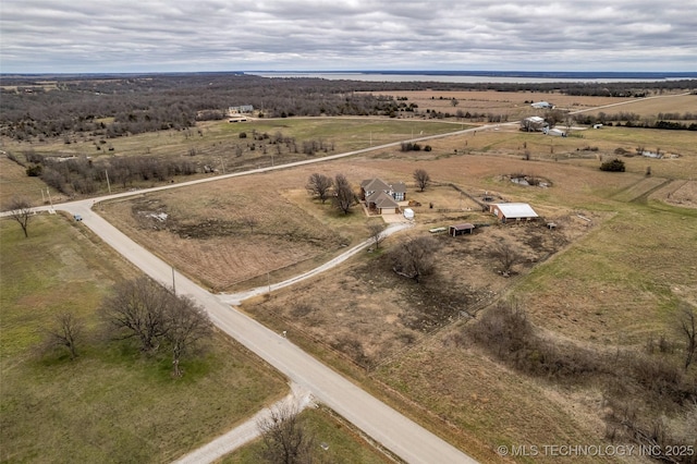 birds eye view of property with a rural view