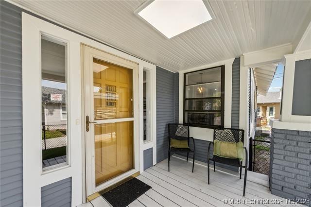 interior space featuring covered porch