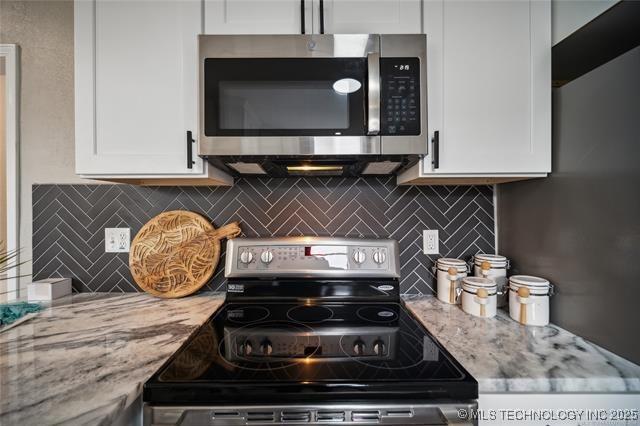 kitchen featuring white cabinets and stainless steel appliances