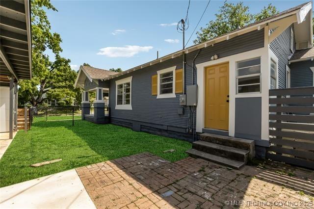 exterior space with a lawn and a patio area