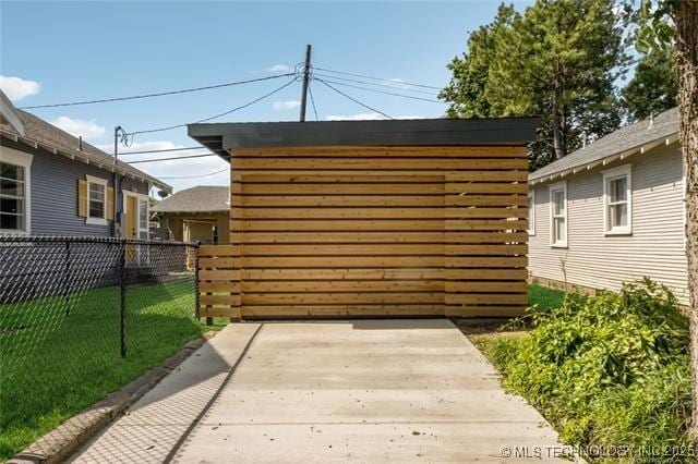 view of outbuilding with a lawn