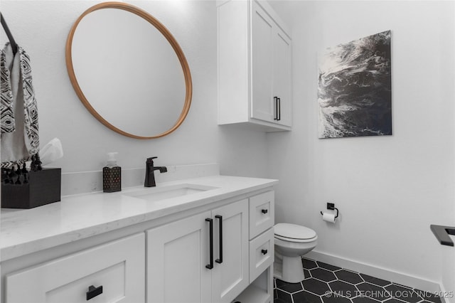 bathroom with vanity and toilet