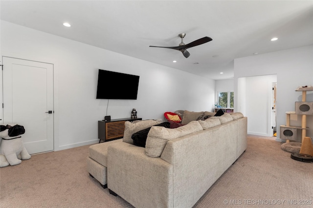 carpeted living room featuring ceiling fan