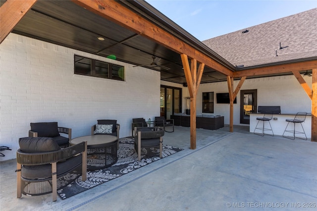 view of patio / terrace with grilling area, an outdoor hangout area, and a ceiling fan