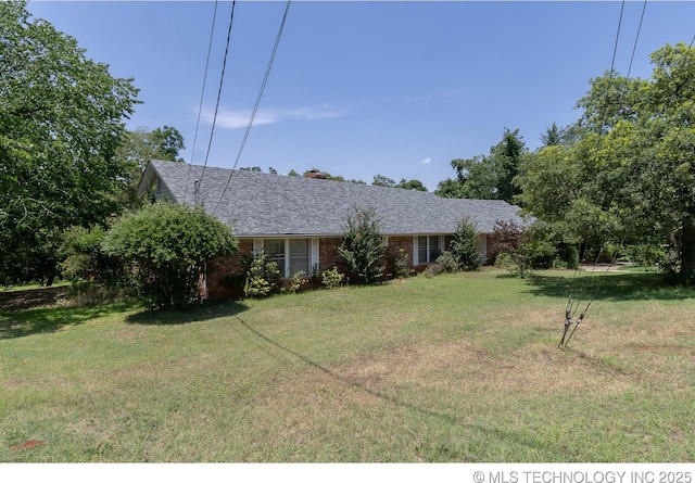 view of front of home with a front yard