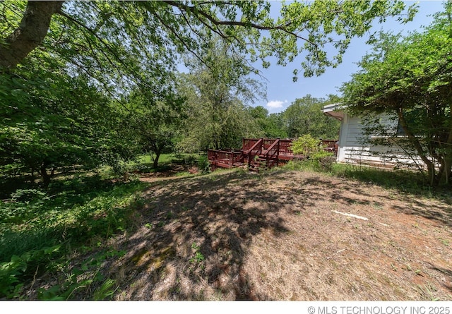 view of yard with a wooden deck