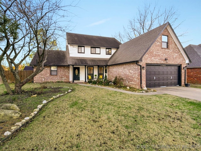 view of front of property with a garage and a front yard