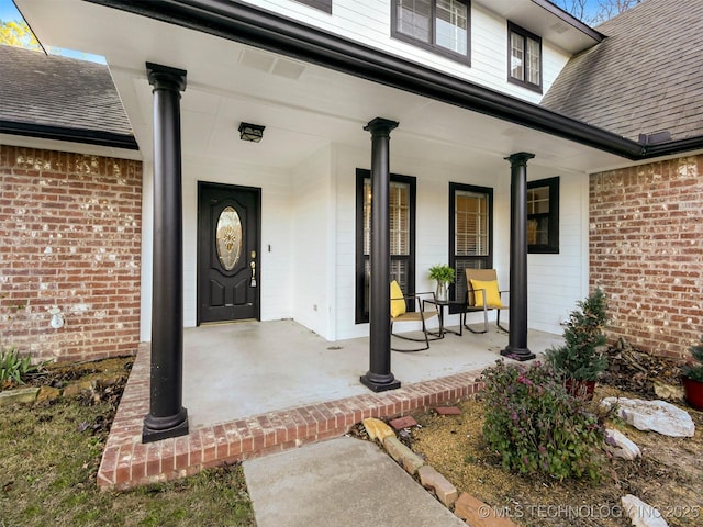 doorway to property with covered porch